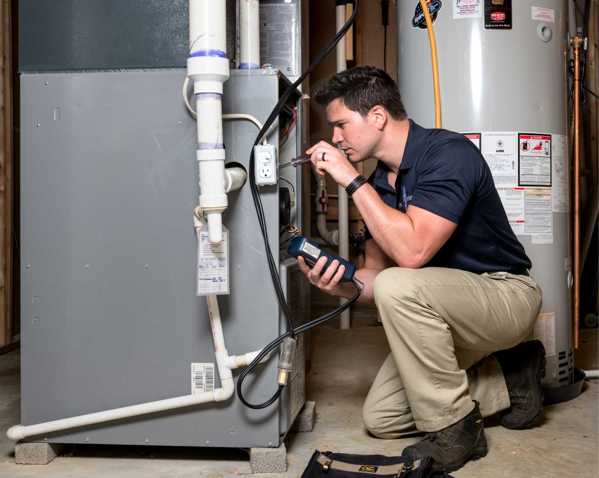 HVAC technician performing a furnace tune-up in Laveen