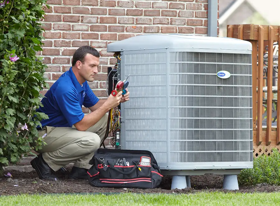 HVAC technician inspecting an outdoor air conditioning unit in Laveen